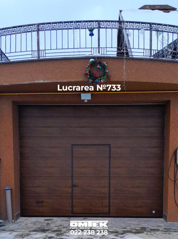 Porți secționate, culoare stejar întunecat, montate în satul Măgdăcești, raionul Criuleni. Porți secționate în Moldova la preț de la producător.